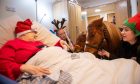 Therapy ponies Squiggles and Haggis meet Dundee care home resident Angie Benvie.