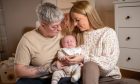 Broughty Ferry couple Kayleigh and Taylor Dalziel gaze lovingly at sleeping baby Greyson, who they conceived through IVF.