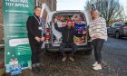 Charity manager Stacey Wallace (right) with Gary Rooney and Fiona Hain from Help for Kids. Image: Kim Cessford/DC Thomson