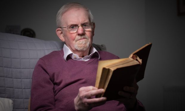 Ian Nimmo White at home with one of his favourite poetry books - Burns's Complete Works (Kilmarnock Edition) Image: Kim Cessford/DC Thomson.