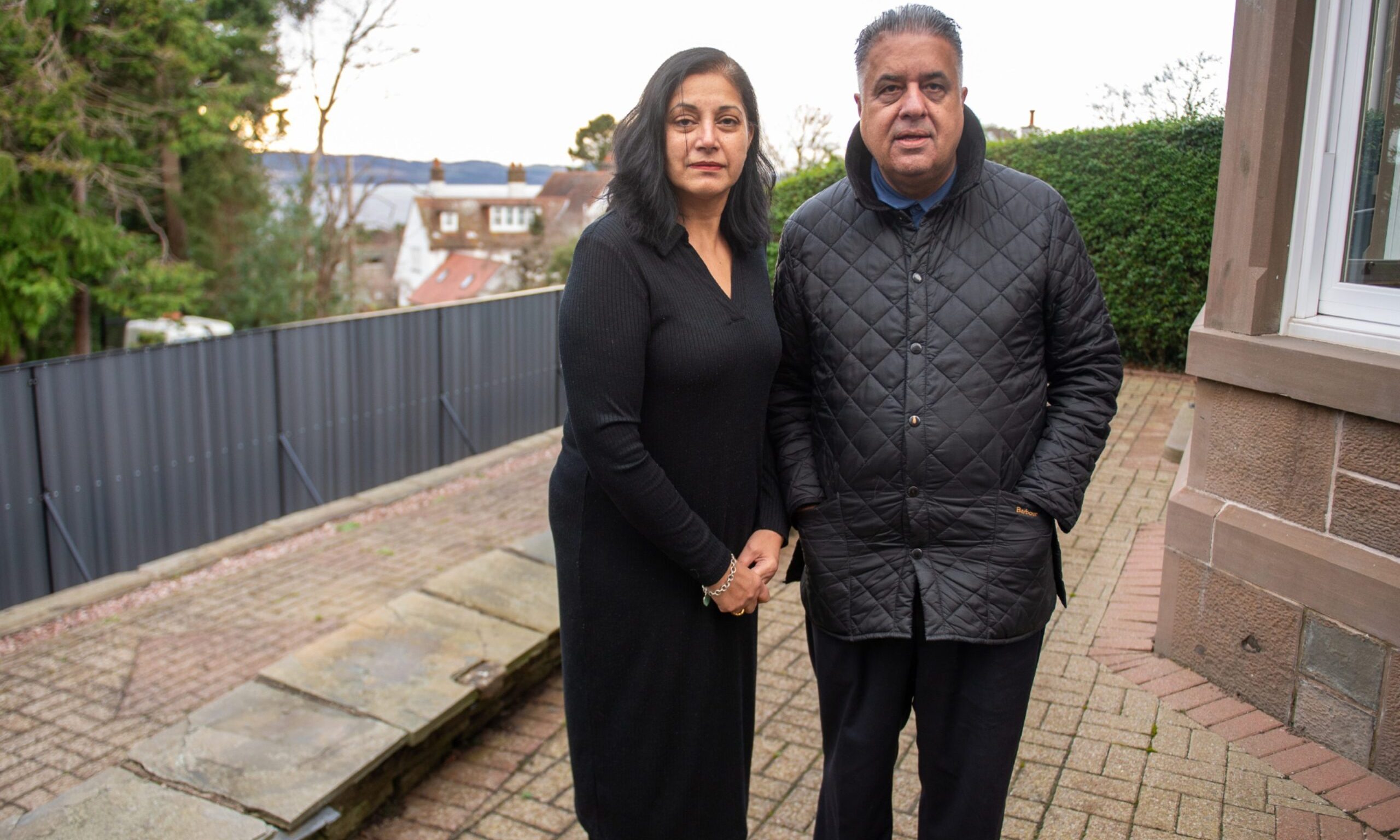Santosh and Kirpal Chima outside their home in Dundee's West End.
