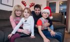 Holly Slessor, 6, with brother Aaron, 8, mum Caroline and dad Stuart. Image: Kenny Smith/DC Thomson.