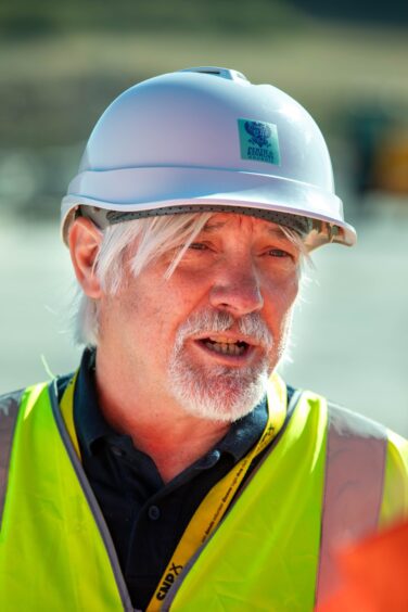 Grant Laing in hard hat and high-vis jacket