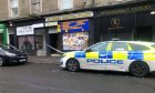 Police taped off the store after break-in on King Street, Dundee.