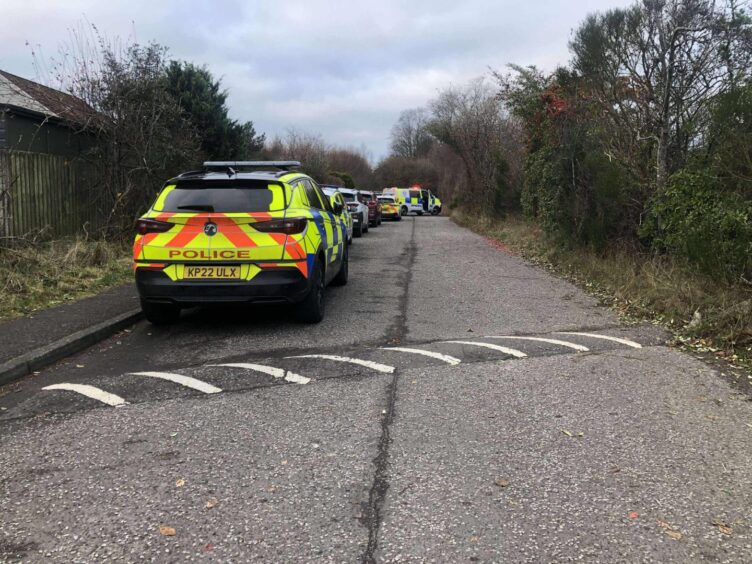 Police at the entrance to Clatto Park in Dundee 