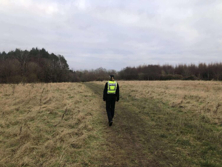 Officers remain at the scene at Clatto Park in Dundee after a body was found 
