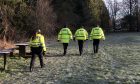 Police carrying out searches at Clatto Country Park after the body was found. Image: James Simpson/DC Thomson