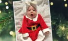 Eight-week-old Nirvanah Cassidy, from Dundee, was aptly dressed for her first visit from Santa Claus. Image: Candy Brett.