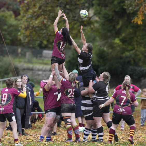 Women playing rugby