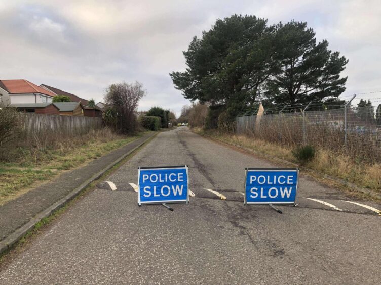 Police have closed the road at Clatto Park 