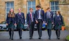 six pupils in uniform in a line outside the front of Morrison's Academy in Crieff