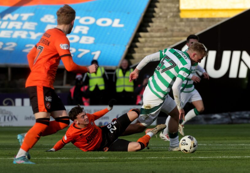 Celtic's Arne Engels (right) is fouled by Dundee United's Miller Thomson