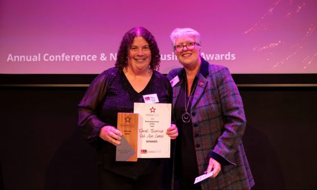 Sarah Thomson, left, receiving her Businesswoman of the Year award from Joyce White OBE Image: Supplied.