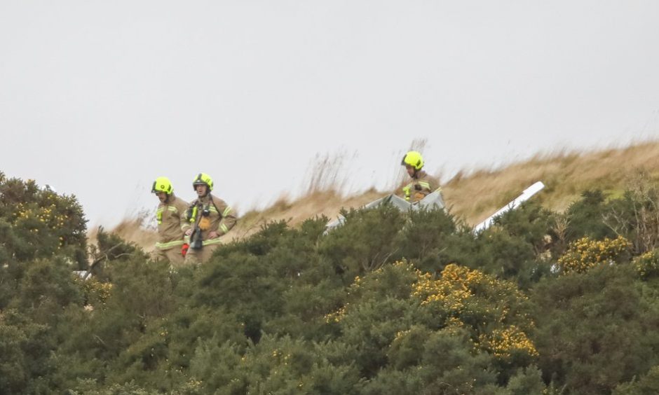 Firefighters at the scene of a light aircraft crash near Kinglassie.