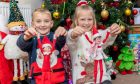 Winners Aaliyah and Ruaridh Smiles with two of their naughty elves. Image: Steve Brown/DC Thomson.