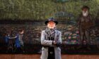 Ian Imrie in front if his new mural, a large painting of Monet's watercolours