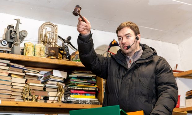 Auctioneer Sean Dowie, 32, in full flow at Pine Lodge Auction in Dunshalt. Image: Steve Brown/DC Thomson