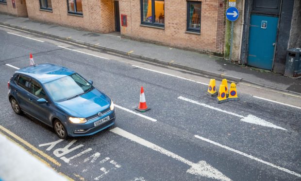 A sinkhole in Canal Street is causing delays. Image: Steve Brown/DC Thomson