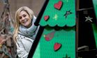 Dundee Unesco City of Design lead officer, Annie Marrs with the 'designer' Christmas trees in Nethergate. Image: Steve Brown/DC Thomson