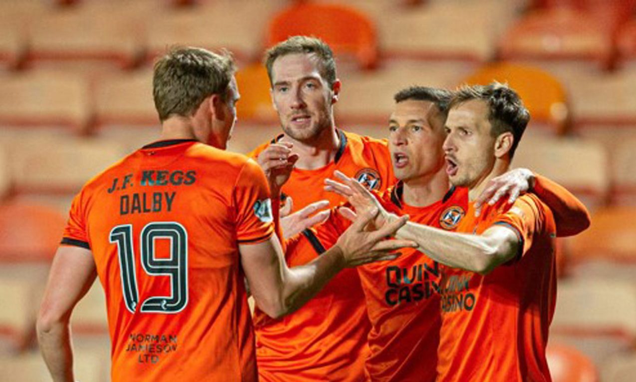 Kevin Holt leads the United celebrations