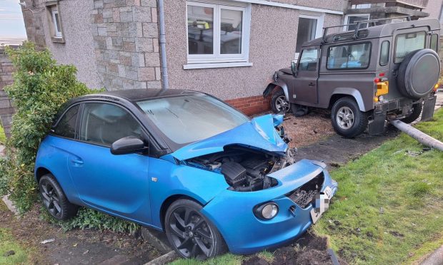 The Land Rover smashed into the Vauxhall then a lamp post and garden in Tayport. Image: Supplied