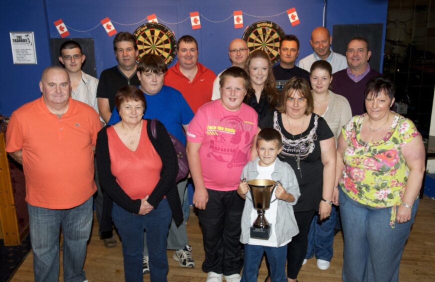 Competitors and The Graham Doig Memorial trophy before the event. 