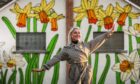 Mural Artist Diane Selbie with her favourite side showing the daffodils.