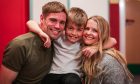 Lawson Anderson, 8, with mum Kelly and dad Craig after finishing his cancer treatment in time for Christmas