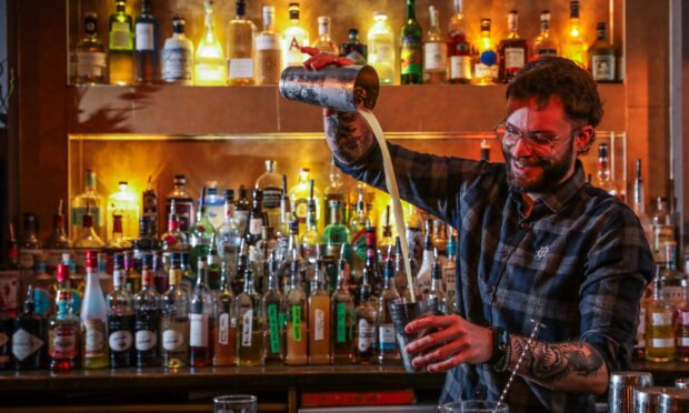 A barman making a cocktail in Bruach Bar.