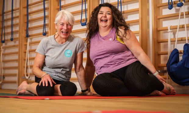 Carnoustie mum Lynsey Smiles has found Iyengar Yoga helps her Graves' disease symptoms. She is pictured with her Iyengar Yoga teacher Julie Anderson.