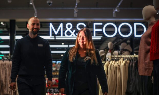 Visual Stylist Callum Wilson with manager Mary Power in the Gallagher Retail Park store. Image: Mhairi Edwards/DC Thomson