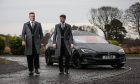 Funeral directors Kevin Taylor and Chris Simpson with their Tesla Hearse.  Image: Mhairi Edwards/DC Thomson