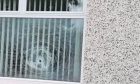 A smashed window in North Muirton.