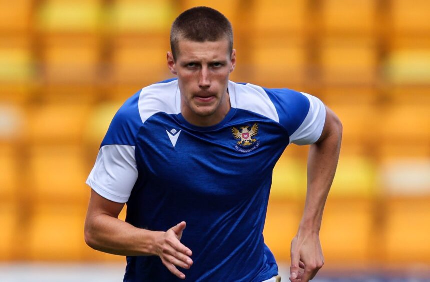 St Johnstone defender, Sam McClelland, warming up before a game.