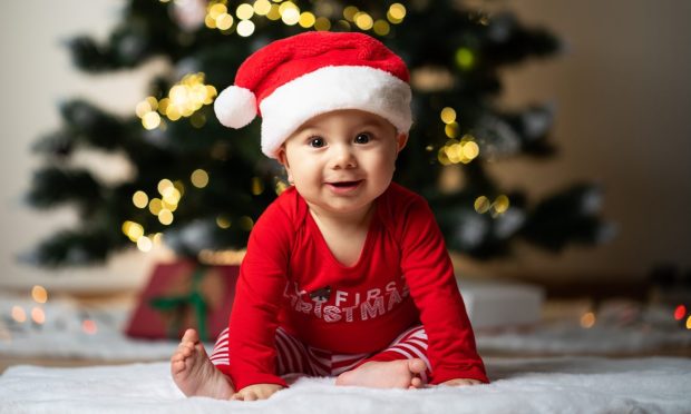 Baby's first Christmas is a magical milestone. Image: Shutterstock.