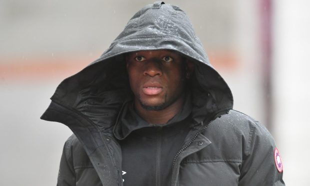 St Johnstone striker Uche Ikpeazu arrives to watch a game.