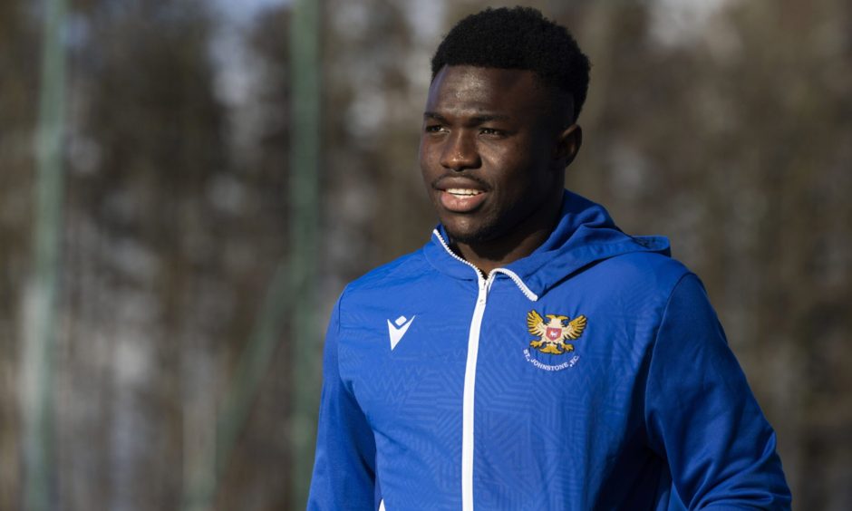 St Johnstone striker Adama Sidibeh walking into McDiarmid Park.