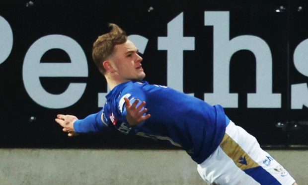 Taylor Steven celebrates with a knee slide after scoring for St Johnstone against Motherwell.