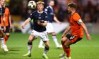 Lyall Cameron of Dundee challenges for the ball with Ross Docherty of Dundee United. Image: David Young/Shutterstock