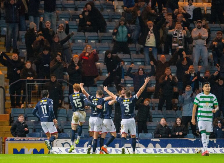 Dundee and Donnelly celebrate in front of fans at Dens Park. Image: Vagelis Georgariou/Shutterstock