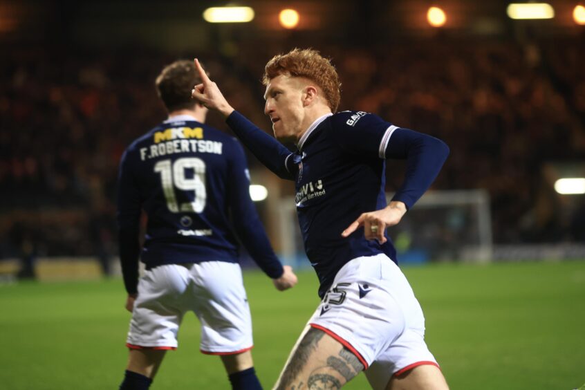 Simon Murray wheels away in front of delirious Dees. Image: David Young/Shutterstock