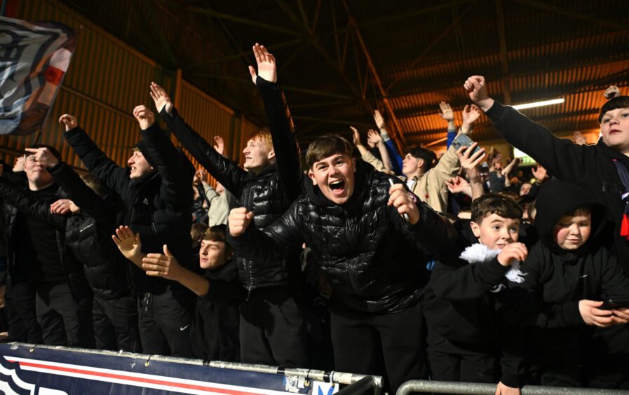 Dundee fans enjoy their night. Image: Mark Runnacles/Shutterstock