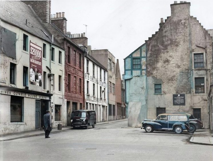 A Danish bacon and Heinz advert is on the wall to the left in this shot of Perth's Watergate area in March 1963.