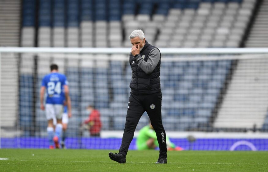 Jim Goodwin cuts a dejected figure after losing out to St Johnstone in the 2021 Scottish Cup semi-final