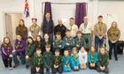 Scout group members band guests at the hall event. Image: Paul Reid