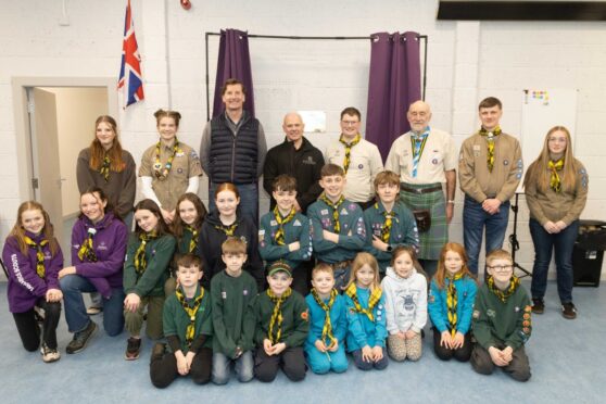 Scout group members band guests at the hall event. Image: Paul Reid