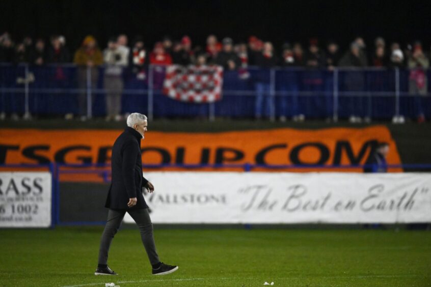 Then-Aberdeen manager Jim Goodwin trudges away at Darvel.