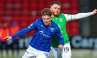 Fran Franczak battles with Hibernian's Nicky Cadden.