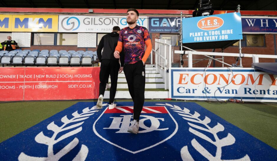 Ryan Strain takes in his surroundings prior to United's win at Dens Park