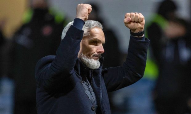 Dundee United boss Jim Goodwin salutes the packed travelling support.